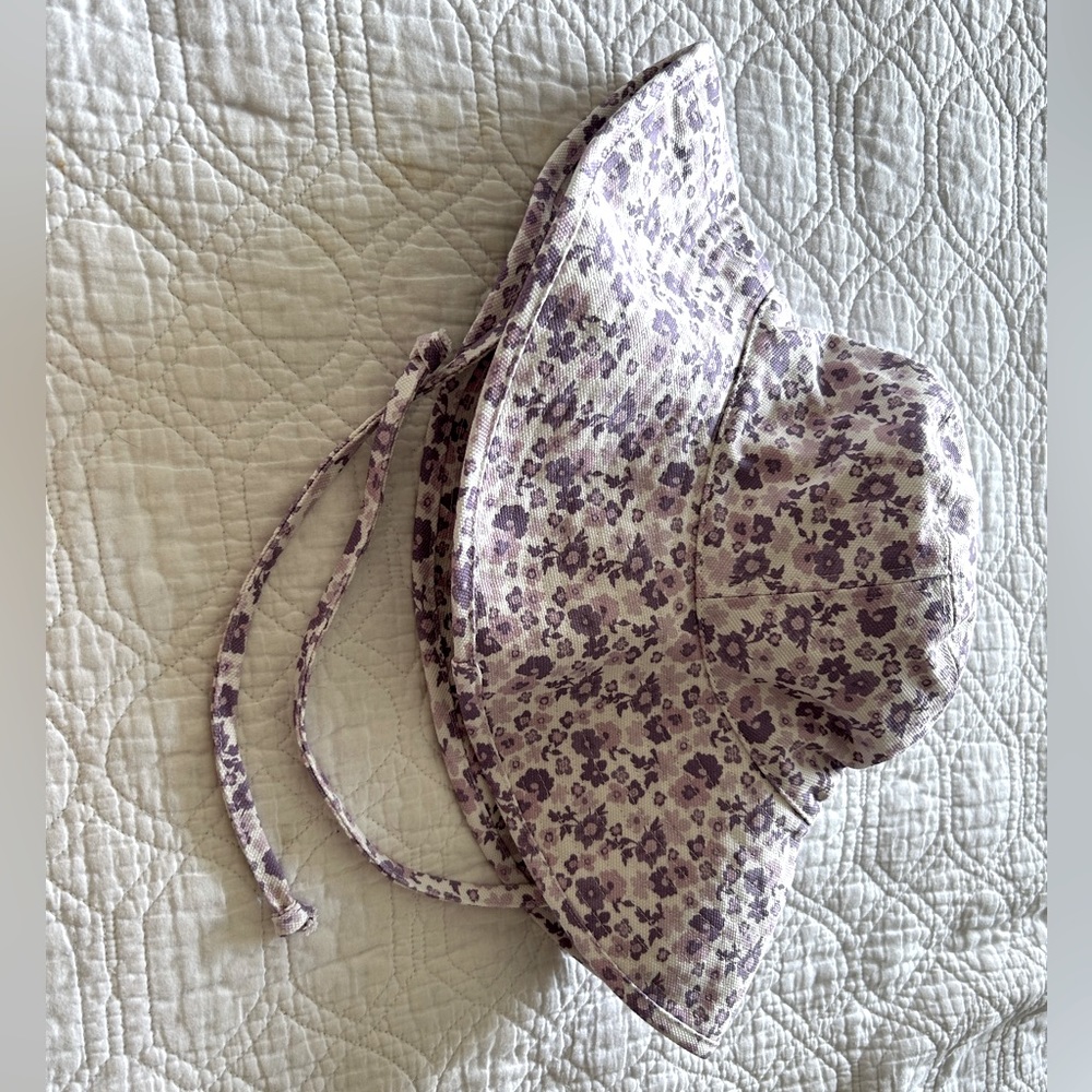 Lack of color floral hat brand new never worn. Accidentally purchased two.